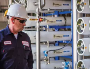 Man looking at reverse osmosis units